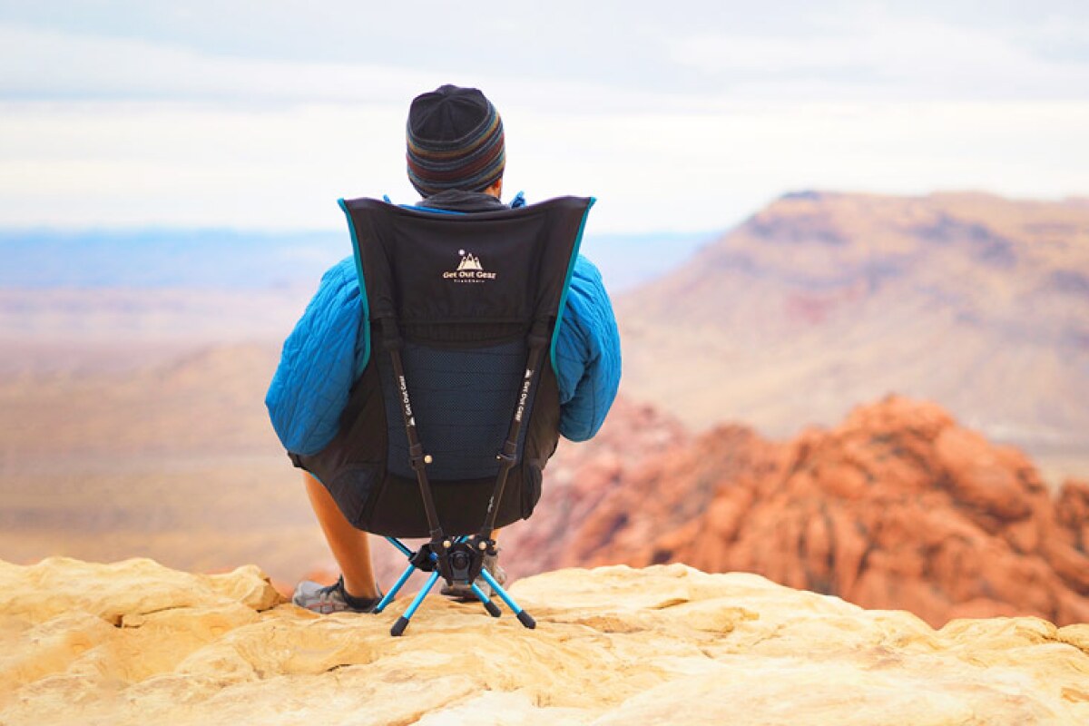 Lightweight folding chair uses trekking poles as part of its frame